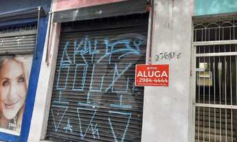 Imagem 4: Salão comercial com banheiro e porta de aço