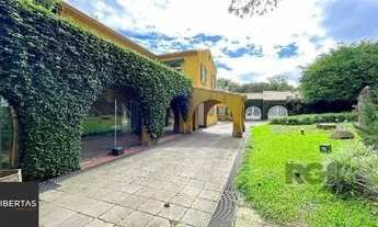 Imagem 2: Casa em Porto Alegre, no bairro Pedra Redonda, com 7 dormitório(s), e 7 banheiro