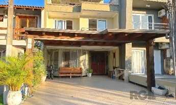 Imagem 3: Casa em Porto Alegre, no bairro Hípica, com 3 dormitório(s), e 3 banheiros, à ve