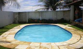 Imagem: Casa de praia com piscina no morro branco