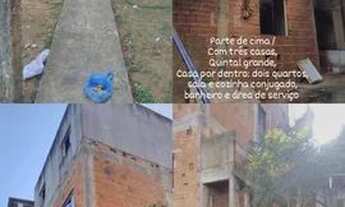 Imagem: Um prédio e uma casa no mesmo quintal