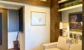 Imagem 4: Sala mobiliada, com churrasqueira para happy hour e vista para o Guaíba