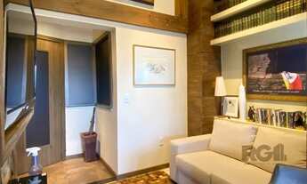 Imagem 2: Sala mobiliada, com churrasqueira para happy hour e vista para o Guaíba