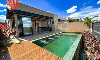 Imagem 2: Casa térrea em condomínio fechado com 03 suítes e piscina borda infinita