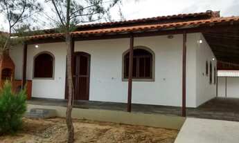 Imagem: Casa e cordeirinho de frente para o mar