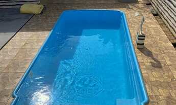 Imagem 6: Casa à Venda com Piscina e Terreno Amplo de 390m² Conforto e Lazer em Localização Tranqui