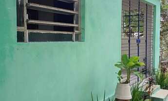 Imagem: Casa com árvores e fruteiras