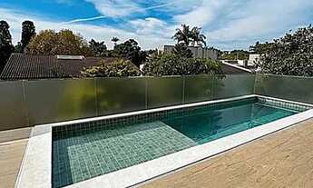 Imagem 2: Casa de condomínio para venda possui 400 metros quadrados com 4 quartos