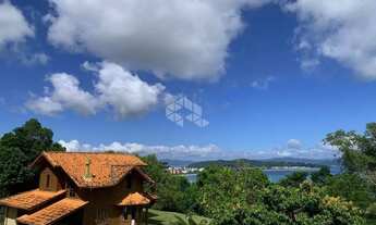 Imagem: Terreno a venda com dois sobrados em Canajurê