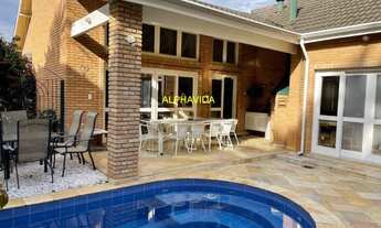 Imagem 1: Casa semi térrea em condmínio fechado, com 4 suite, repleta de armários, piscina, churrasq