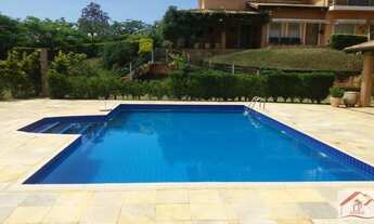 Imagem 4: Casa de condomínio para venda possui 610 metros quadrados com 5 quartos