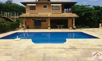 Imagem 2: Casa de condomínio para venda possui 610 metros quadrados com 5 quartos