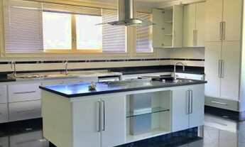 Imagem 2: Casa de condomínio térrea para venda possui 1120 metros quadrados com 5 quartos