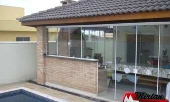 Imagem 2: Casa com piscina para venda em condomínio fechado em Peruibe. 4 suítes sendo 2 com closet