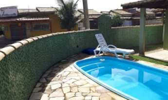 Imagem: Casa com piscina pertinho da praia. Disponível