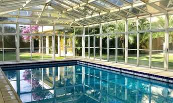 Imagem 6: Casa de condomínio térrea para venda possui 1120 metros quadrados com 5 quartos