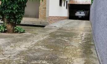 Imagem 5: Casa com prédio