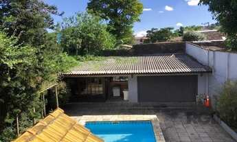 Imagem 4: Casa de 365m² - 4 dormitórios sendo 3 suítes e 5 vagas de garagem no bairro Partenon