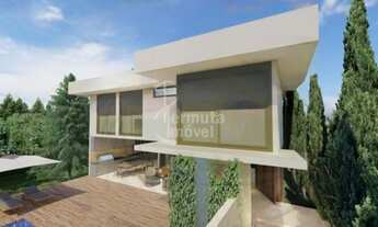 Imagem 2: Casa a venda com 400 m²; 4 suítes, lavabo, lavanderia, sala de estar e jantar e garagem no