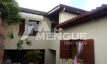 Imagem 2: Casa com 4 dormitórios e 2 vaga de garagem, à venda no bairro Parque dos Maias em Porto Al