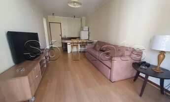 Imagem 2: Flat mobiliado com arrumação de quarto, com cozinha completa com geladeira grande. Sem bur