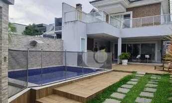 Imagem 2: Linda casa em condomínio fechado com 6 quartos sendo 4 suítes, ampla sala para 3 ambientes