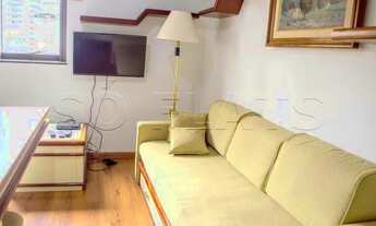 Imagem 3: Flat mobiliado com arrumação de quarto, com cozinha completa com geladeira grande. Sem bur