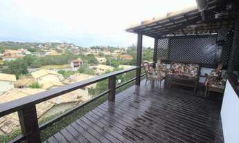 Imagem 1: Casa de condomínio para venda tem 170 metros quadrados com 5 quartos