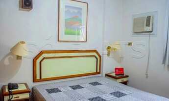 Imagem 6: Flat mobiliado com arrumação de quarto, com cozinha completa com geladeira grande. Sem bur