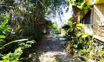 Imagem 3: ?? Pé na Areia! Terreno de 1.809 m² com 2 casas na Praia do Santinho - Florianópolis