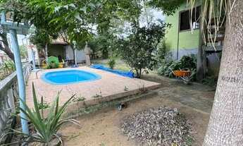 Imagem 2: Chácara à venda em Guarapari-ES: Oportunidade em Andana com 2 quartos, sala de estar e TV