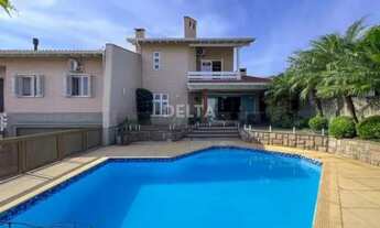 Imagem: Casa com 3 suítes, pátio, piscina a venda