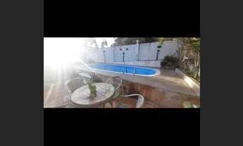 Imagem 4: Casa para venda tem 220 metros com 4 quartos e piscina e sauna