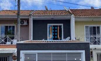 Imagem 2: Sobrado com área de churrasqueira, vaga coberta, terraço no fundo