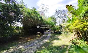 Imagem 2: ?? Pé na Areia! Terreno de 1.809 m² com 2 casas na Praia do Santinho - Florianópolis