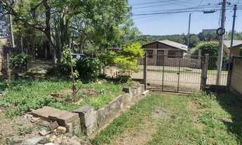 Imagem 5: Terreno com uma casa de madeira no Jardim Fiuza em Viamão REF