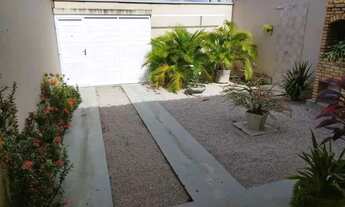 Imagem 2: Casa em jardim tropical