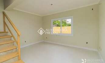 Imagem 2: Casa de condomínio para venda tem 102 metros quadrados com 3 quartos