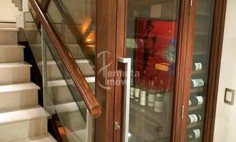 Imagem 3: Casa para venda mobiliada com 430m², 4 suítes, sala de TV, piscina, adega e paisagismo no