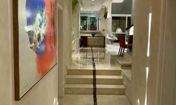 Imagem 6: Casa para venda mobiliada com 430m², 4 suítes, sala de TV, piscina, adega e paisagismo no