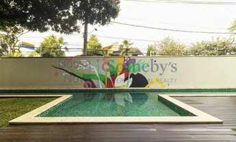 Imagem 5: Casa reformada com projeto paisagístico