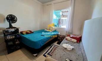 Imagem 7: Casa com rua asfaltada no litoral