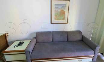 Imagem 6: Flat mobiliado com arrumação de quarto, com cozinha completa com geladeira grande. Sem bur