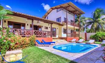 Imagem: Casa rústica com piscina e vista para a