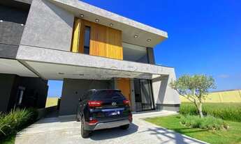 Imagem 2: Belo sobrado com design diferenciado e detalhes minimalistas em madeira e fachada assimétr