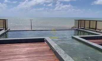 Imagem: Flat com projetados e vista para o mar da