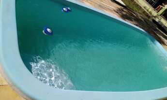 Imagem 3: Casa com piscina e churrasqueira