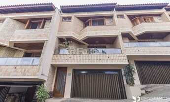 Imagem 1: Casa de condomínio para venda tem 232 metros quadrados com 3 quartos em Ipanema - Porto Al