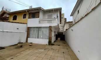 Imagem: SORADO COM 03 DORMITORIOS E 07 VAGAS - QUINTAL