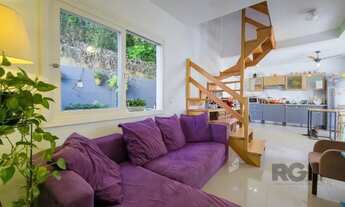 Imagem: Living em dois ambientes com cozinha americana